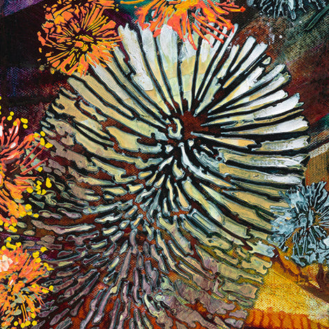 Close-up of a textured, multicolored art piece with a prominent central pattern.